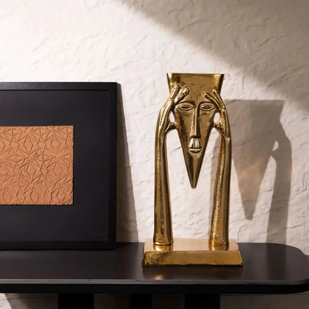 Gold Masked Figure Sculpture