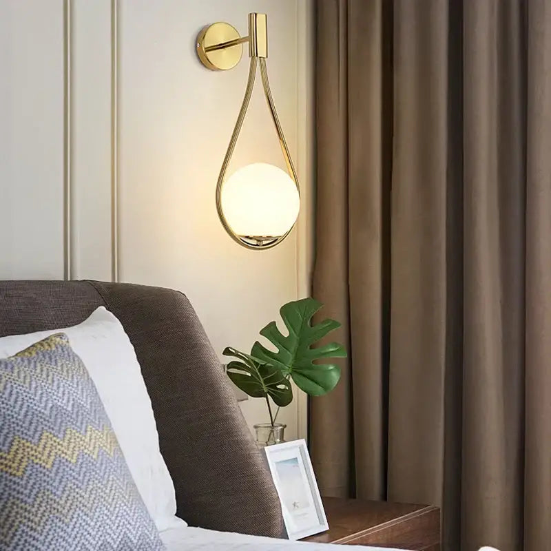 Gold Teardrop Wall Sconce with Glass Globe Shade