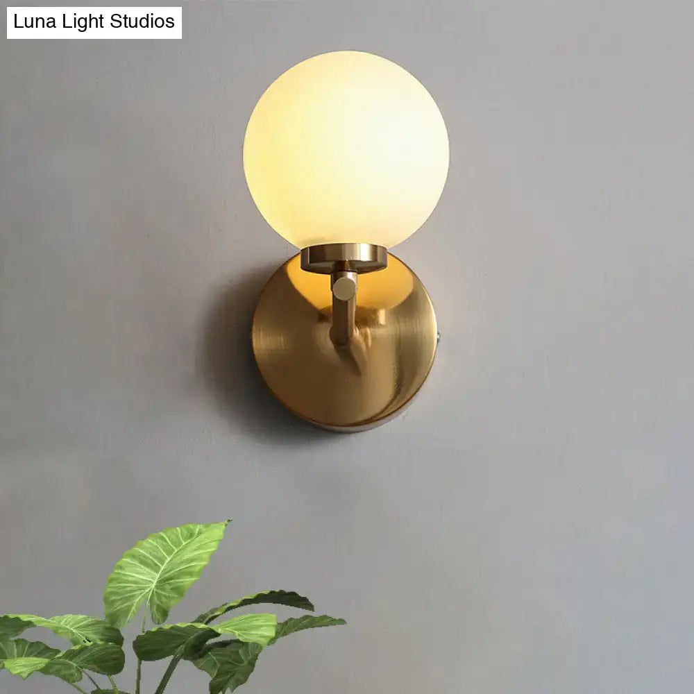 Brass Globe Compact Wall Sconce