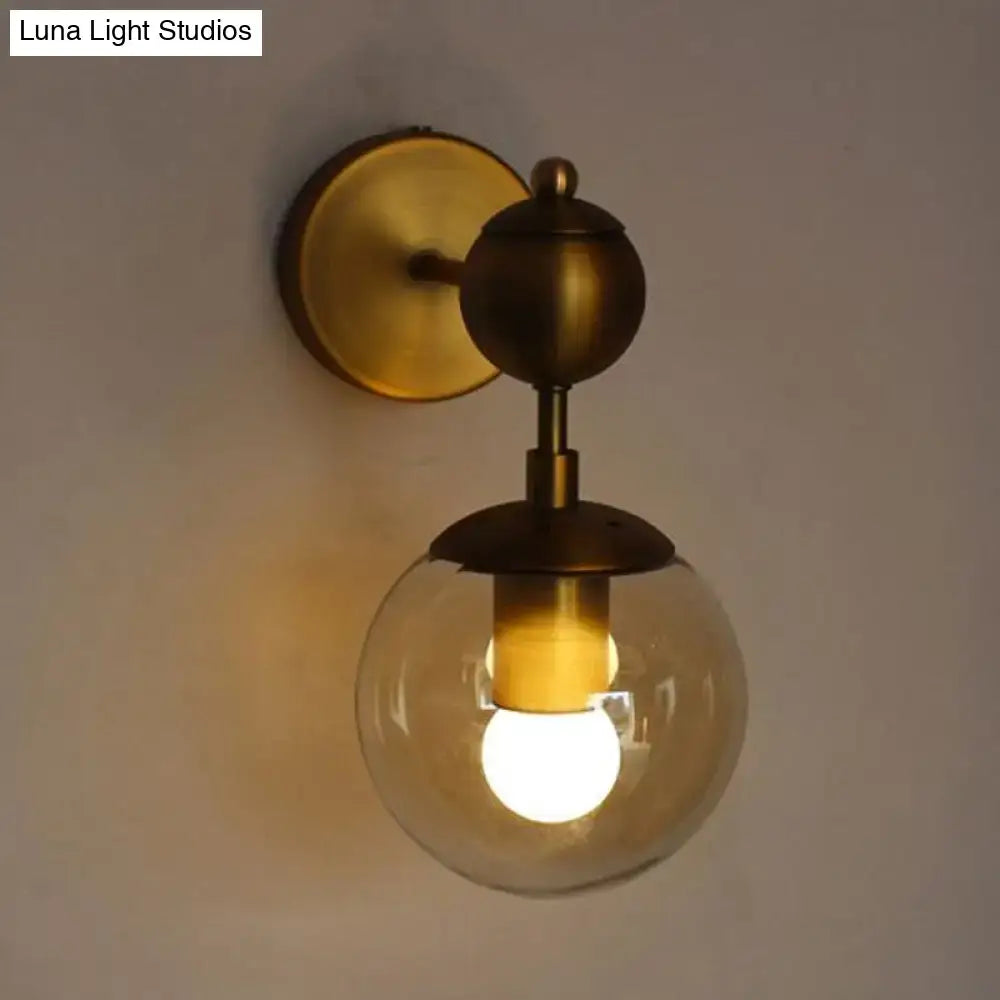Brass Amber Globe Sconce