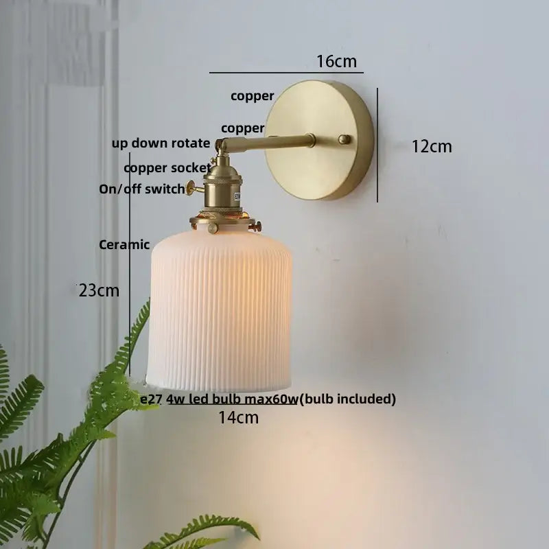 Vintage brass wall light with ribbed glass and knob switch bedroom