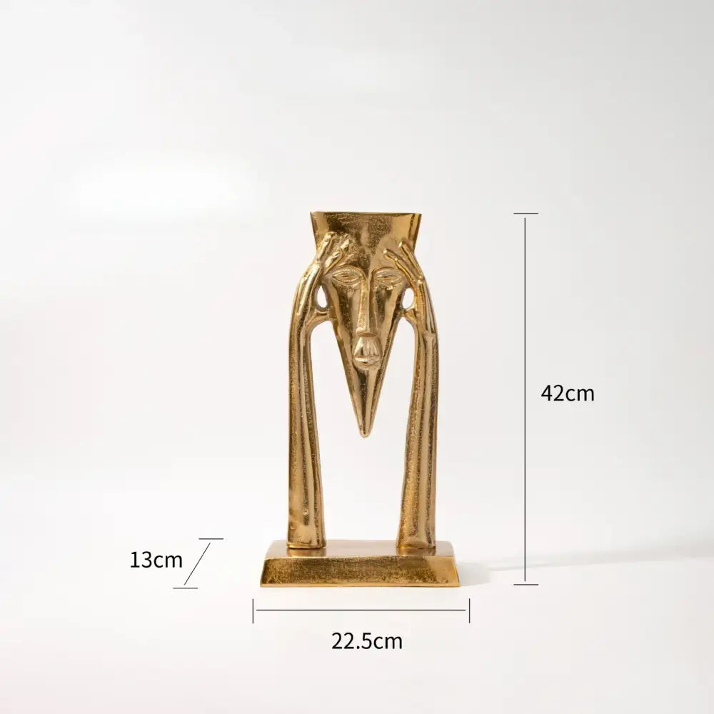Gold Masked Figure Sculpture