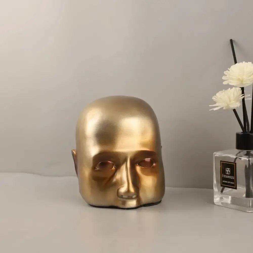Gold Abstract Face Sculpture