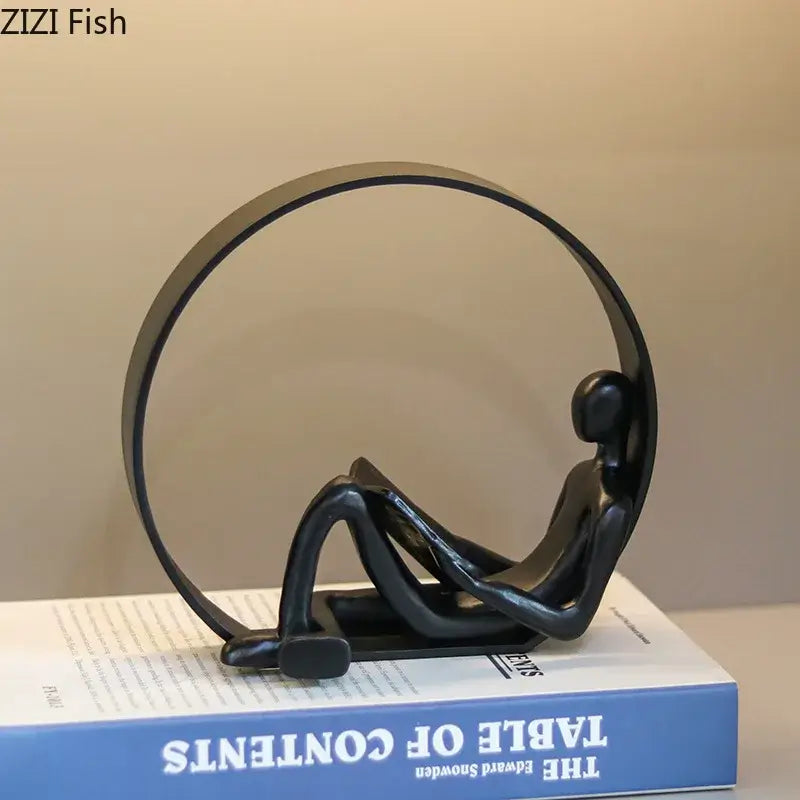 Black Resin Reading Figurine