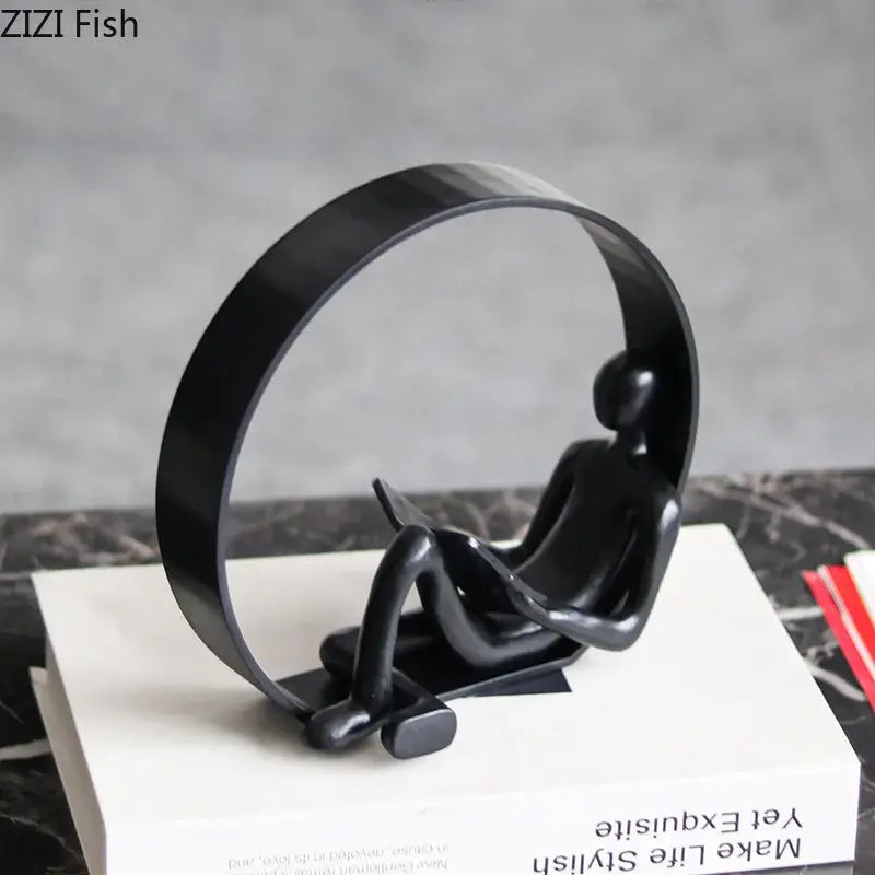 Black Resin Reading Figurine