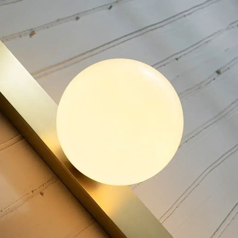Brass Globe Living Room Wall Sconce