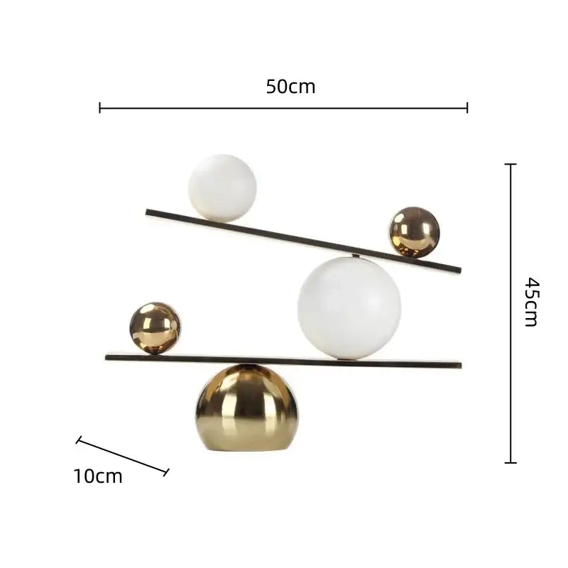 Gold Geometric Seesaw Sculpture