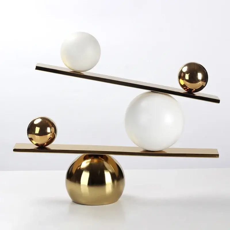 Gold Geometric Seesaw Sculpture