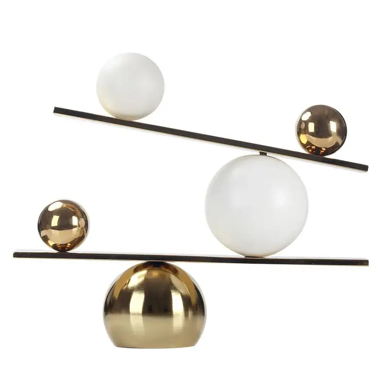 Gold Geometric Seesaw Sculpture