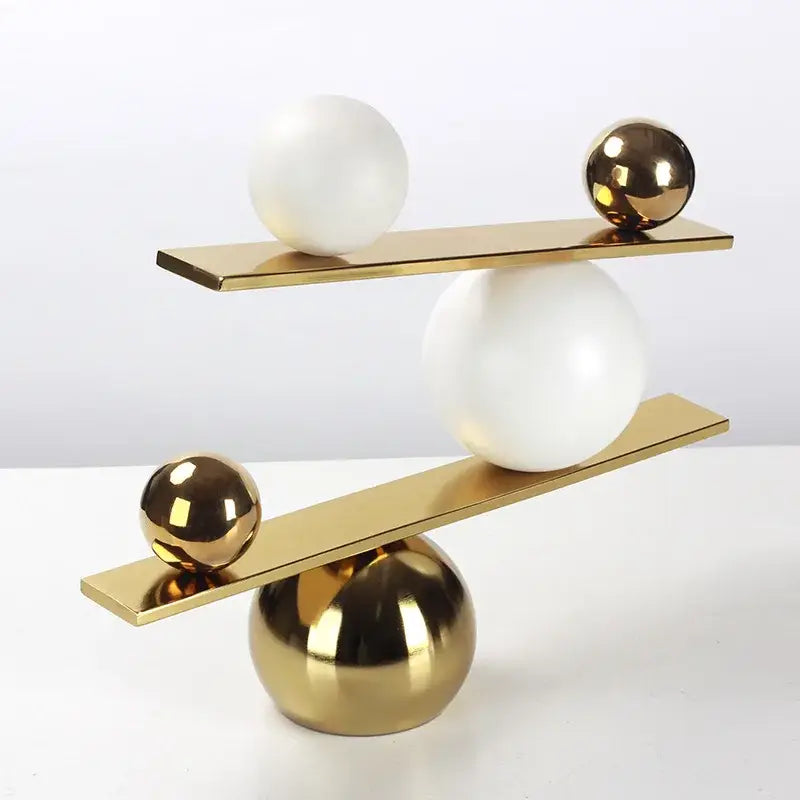 Gold Geometric Seesaw Sculpture