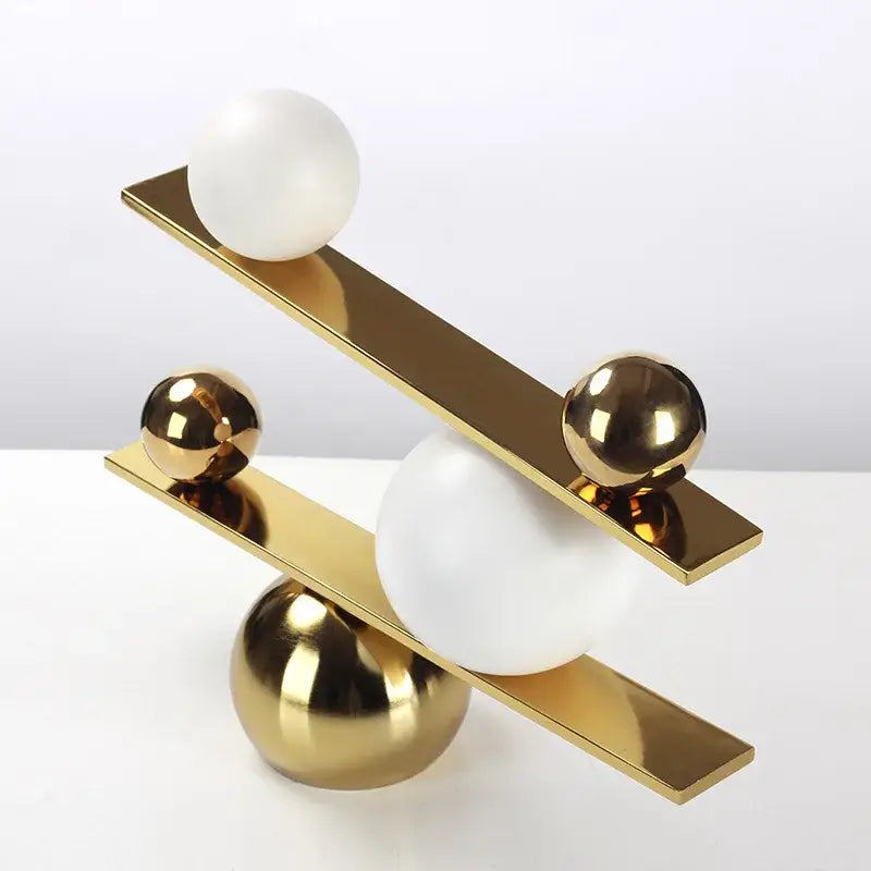 Gold Geometric Seesaw Sculpture
