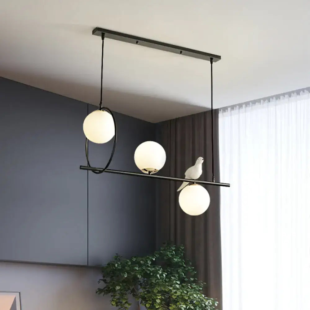 Black Milk Glass Bird Three-Light Pendant