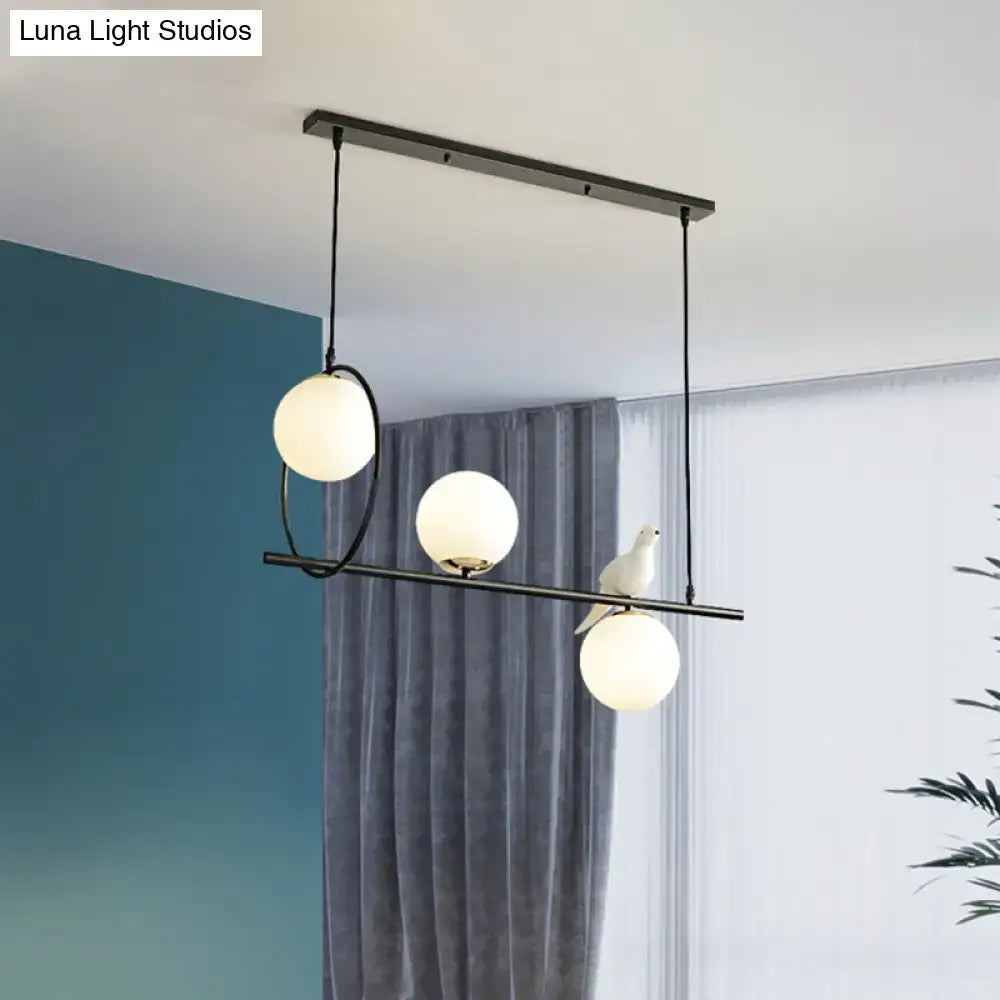 Black Milk Glass Bird Three-Light Pendant