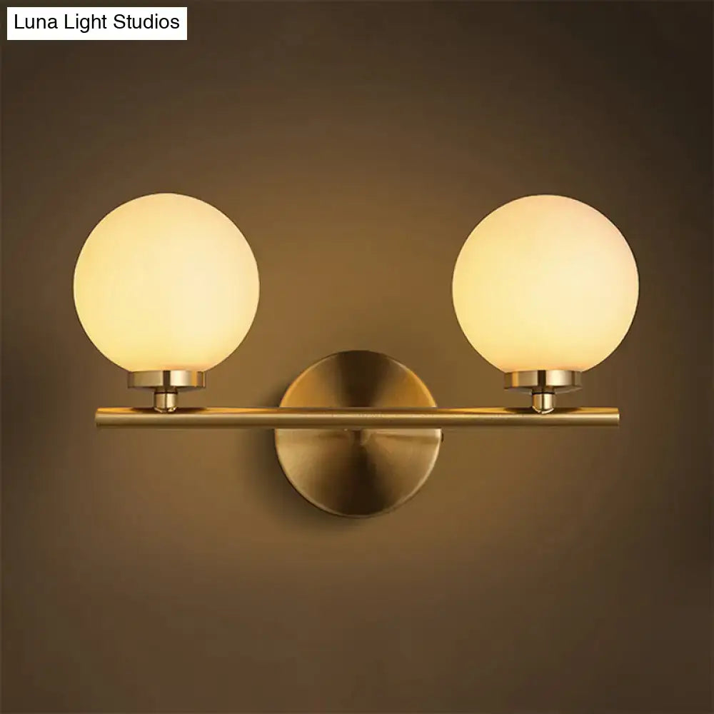 Brass Globe Compact Wall Sconce