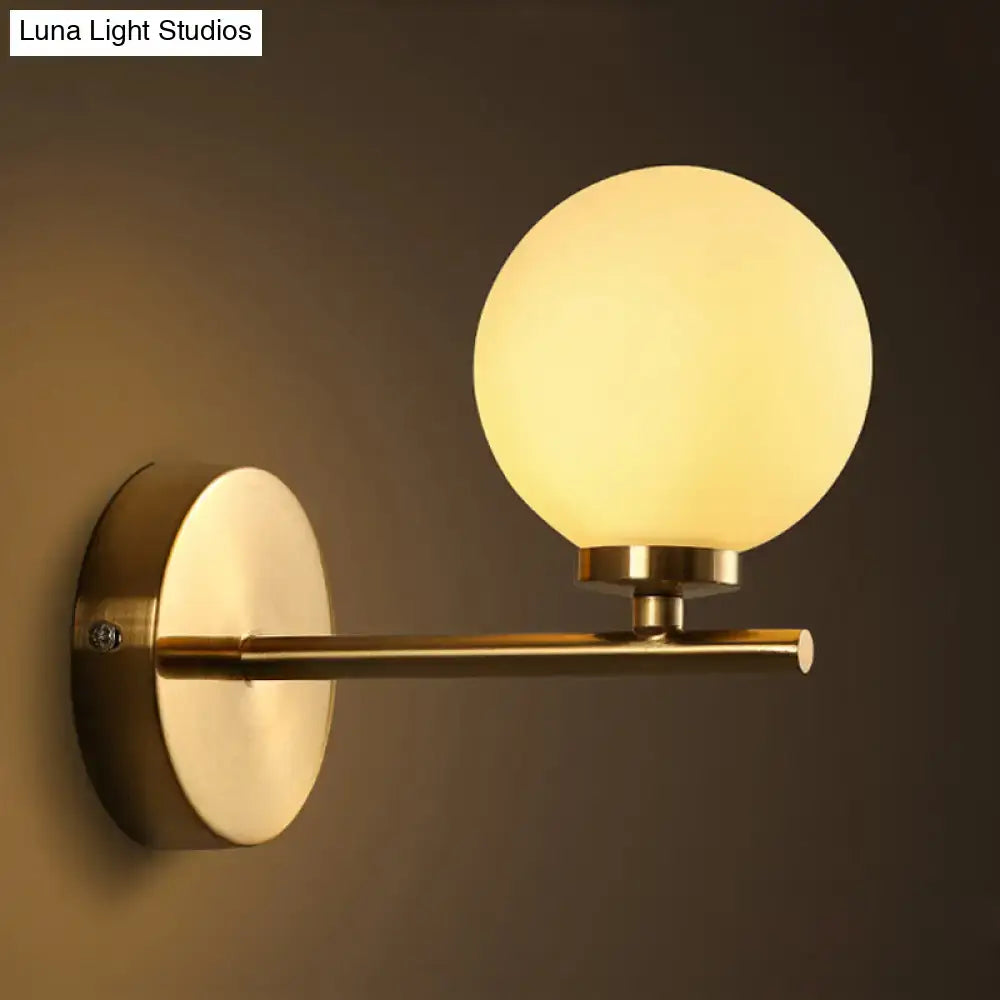 Brass Globe Compact Wall Sconce