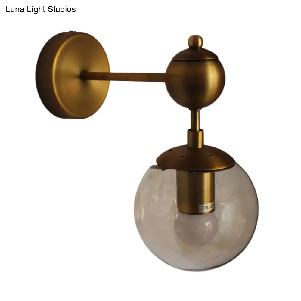 Brass Amber Globe Sconce